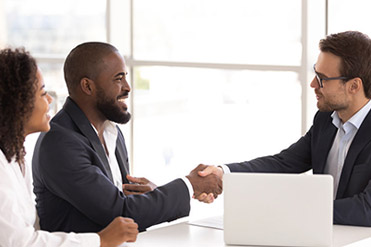 Two men and a woman talking